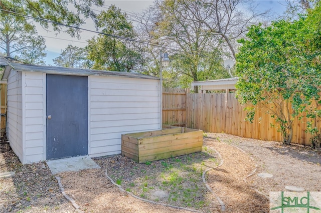 view of shed with a fenced backyard