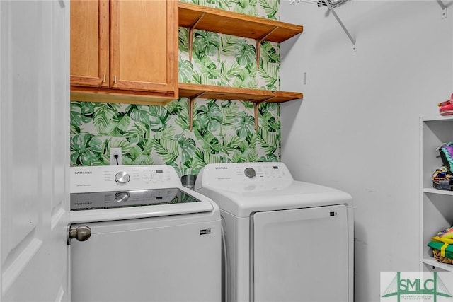 laundry area featuring cabinet space and independent washer and dryer