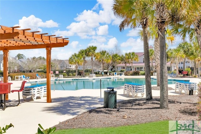 community pool with a patio and a pergola