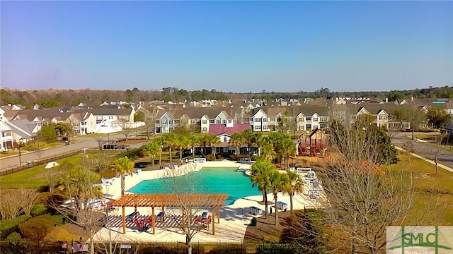 pool featuring a residential view and a patio