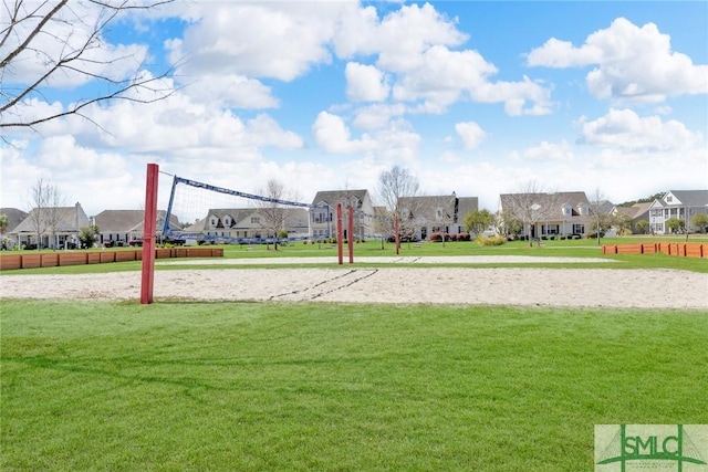 view of property's community featuring volleyball court, a residential view, and a lawn