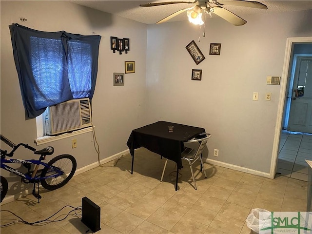 playroom with light tile patterned floors, a textured ceiling, a ceiling fan, and baseboards