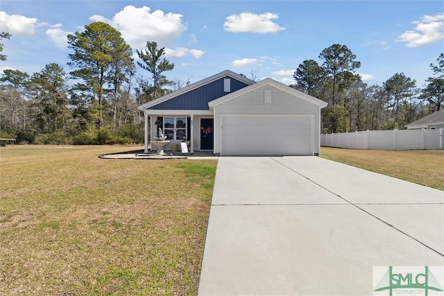 view of front of property with a garage, fence, driveway, and a front lawn