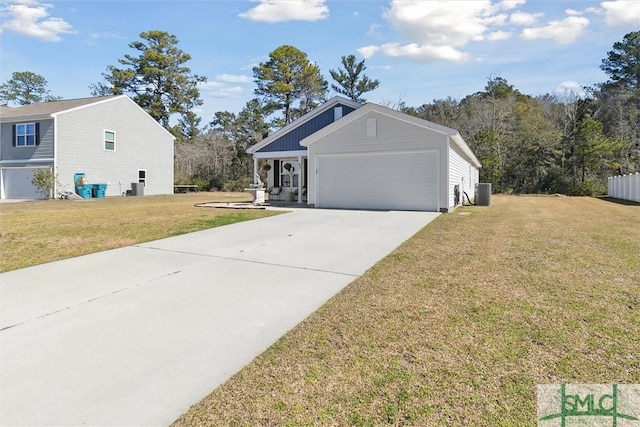 exterior space featuring a front yard, concrete driveway, an attached garage, and central air condition unit