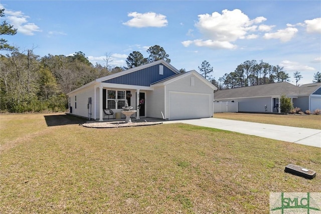 view of front of house with a garage, driveway, and a front yard