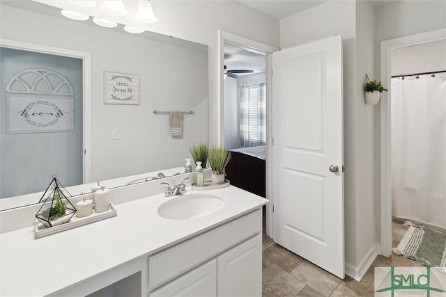 full bath featuring a ceiling fan and vanity