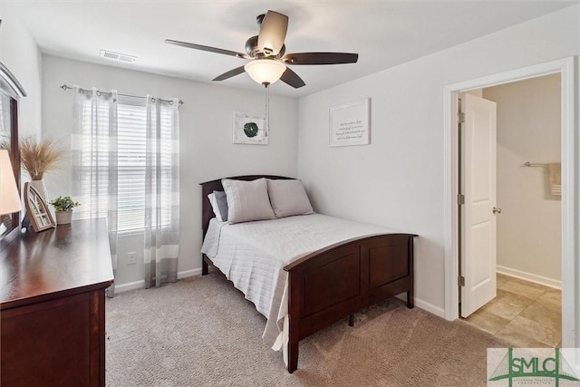 bedroom with a ceiling fan, visible vents, light carpet, and baseboards