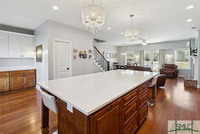 kitchen with light countertops, dark wood finished floors, and recessed lighting