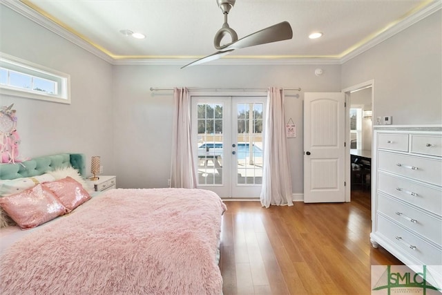 bedroom with ceiling fan, wood finished floors, access to outside, french doors, and crown molding