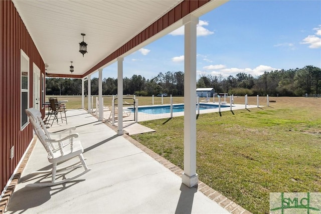 view of patio featuring a fenced in pool