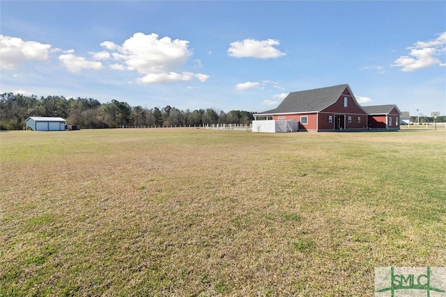 view of yard with an outbuilding and a barn