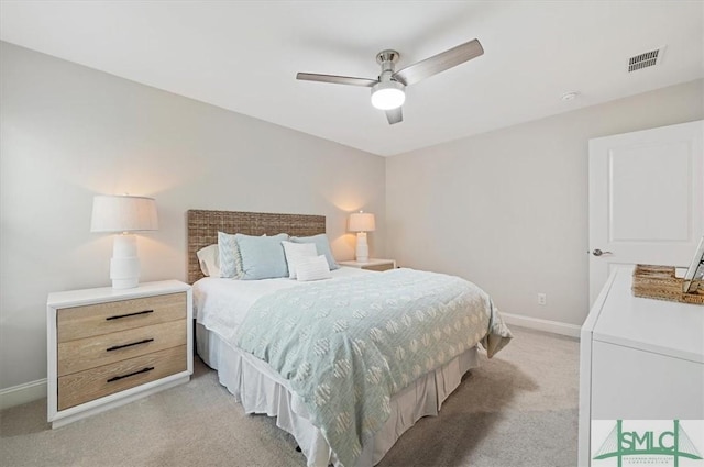 bedroom with a ceiling fan, visible vents, light carpet, and baseboards