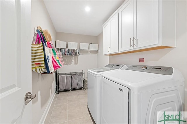 123 Canter Ct, Savannah, GA 31406 - laundry room featuring washing machine and clothes dryer, cabinet space, light tile patterned flooring, and baseboards