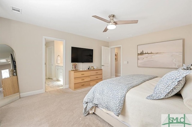 bedroom with baseboards, visible vents, ensuite bath, ceiling fan, and carpet flooring