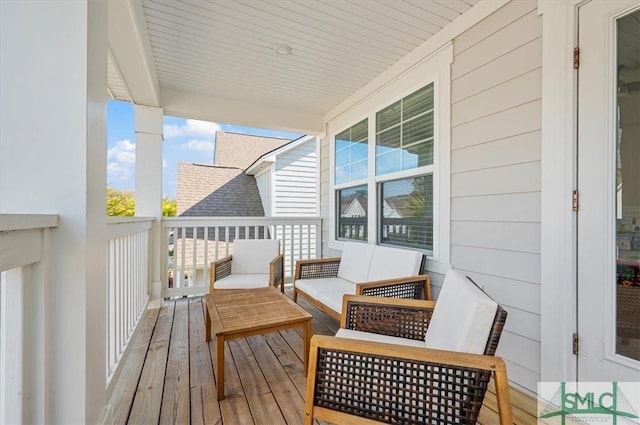 balcony with a sunroom and outdoor lounge area