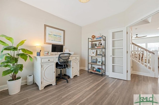 office space with light wood finished floors and baseboards