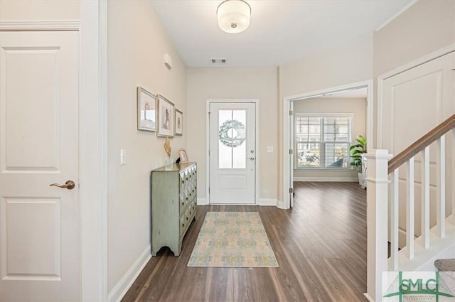 123 Canter Ct, Savannah, GA 31406 - foyer entrance featuring dark wood-style flooring, baseboards, and stairway