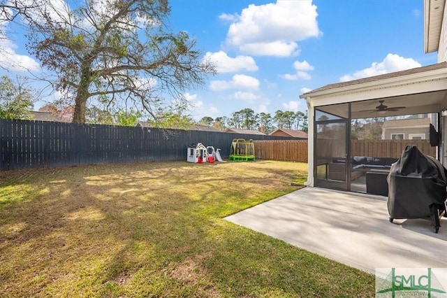 view of yard featuring outdoor lounge area, a patio area, a fenced backyard, and a sunroom