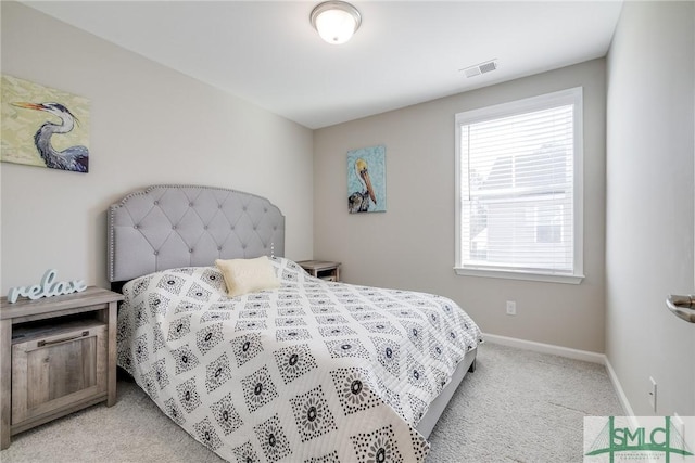 bedroom featuring light carpet, baseboards, and visible vents