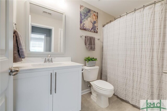 full bathroom with toilet, vanity, and visible vents