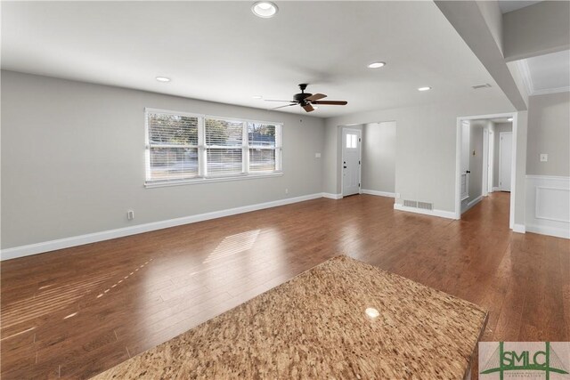 unfurnished living room with visible vents, a ceiling fan, wood finished floors, recessed lighting, and baseboards