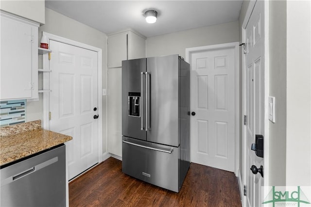 kitchen featuring dark wood-style floors, white cabinets, stainless steel appliances, and open shelves