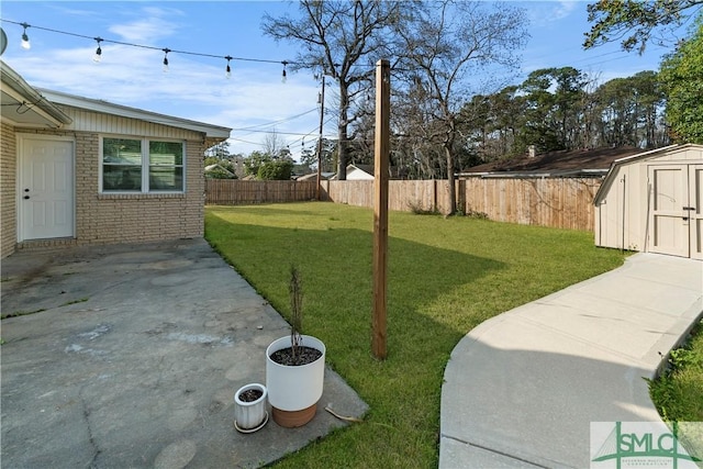 view of yard with a storage shed, a fenced backyard, an outbuilding, and a patio