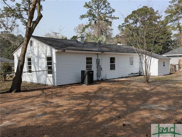 back of property featuring central AC unit