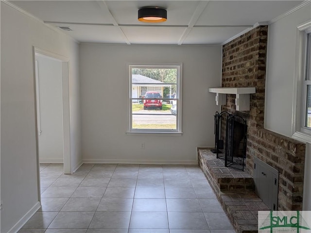 interior space with light tile patterned floors, visible vents, baseboards, and a fireplace