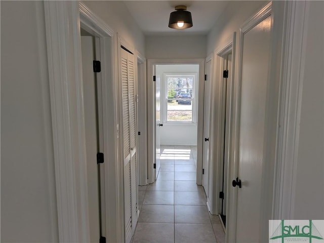 corridor featuring light tile patterned floors