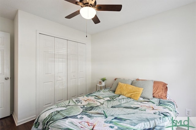 bedroom with a ceiling fan, a closet, dark wood-style flooring, and baseboards