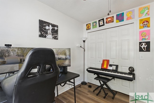 office area with wood finished floors and a textured ceiling