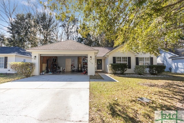 ranch-style home with a garage, a front yard, and driveway