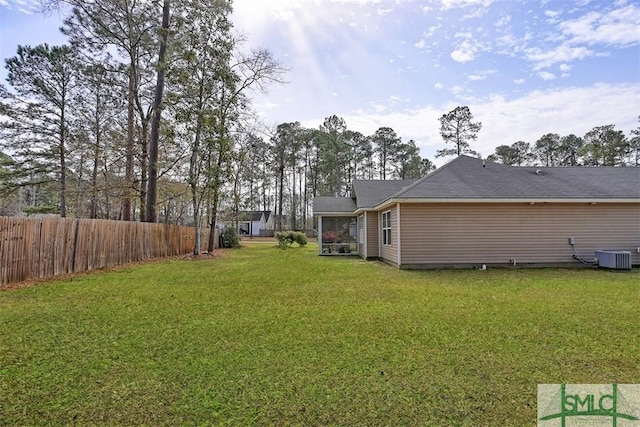 view of yard featuring cooling unit and fence