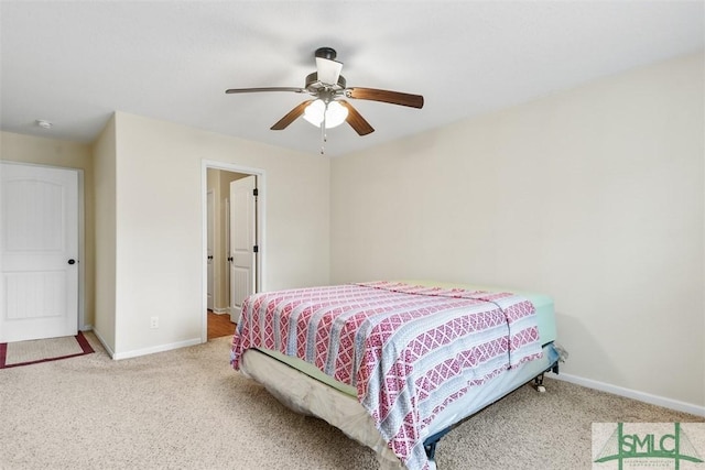 carpeted bedroom with baseboards and ceiling fan