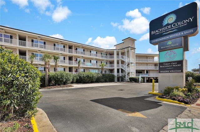 view of property featuring uncovered parking