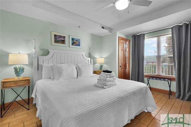 bedroom featuring visible vents, a ceiling fan, light wood-type flooring, and baseboards