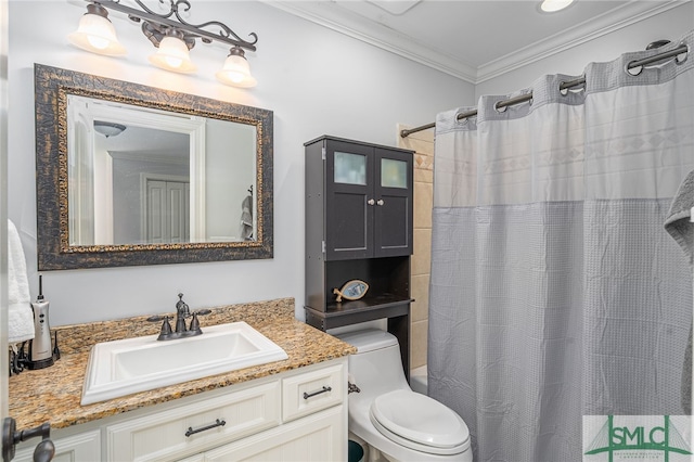 bathroom featuring vanity, crown molding, and toilet