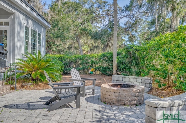 view of patio / terrace with an outdoor fire pit