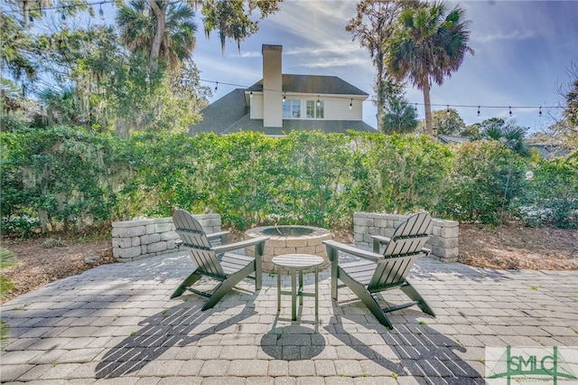 view of patio featuring an outdoor fire pit