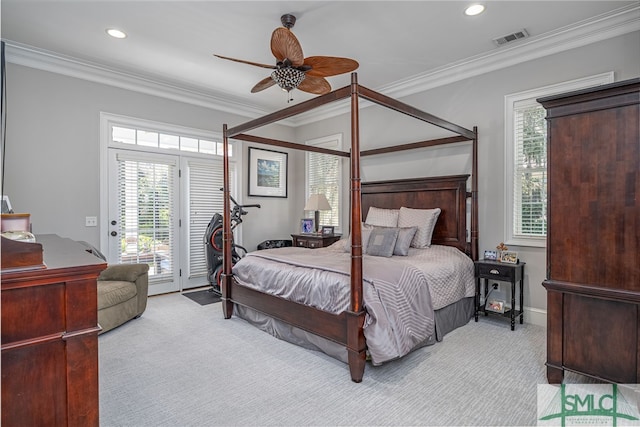 bedroom featuring visible vents, multiple windows, ornamental molding, carpet flooring, and access to exterior