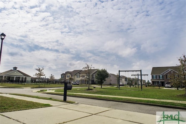 surrounding community with a lawn and a residential view