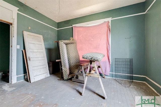 interior space featuring baseboards