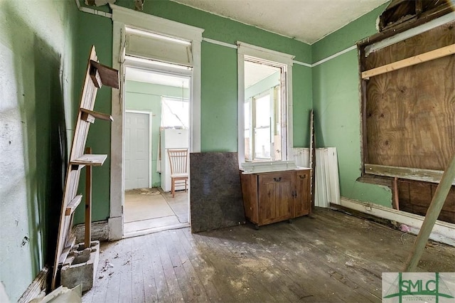 interior space featuring radiator heating unit and hardwood / wood-style flooring