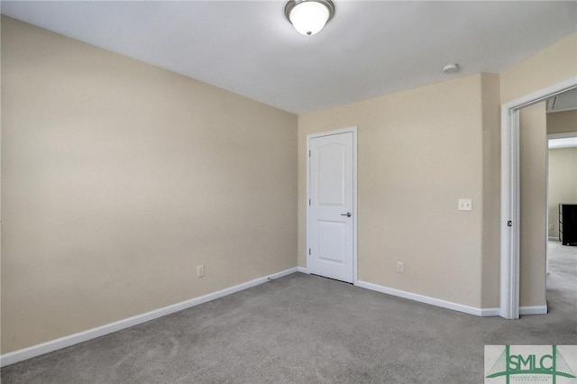 unfurnished bedroom with baseboards and carpet floors