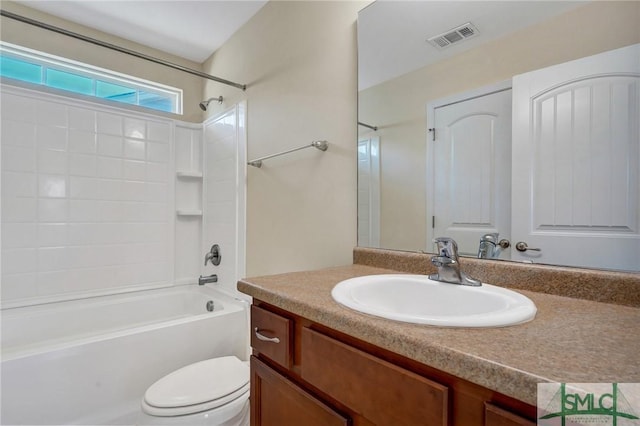 bathroom featuring vanity, bathtub / shower combination, toilet, and visible vents