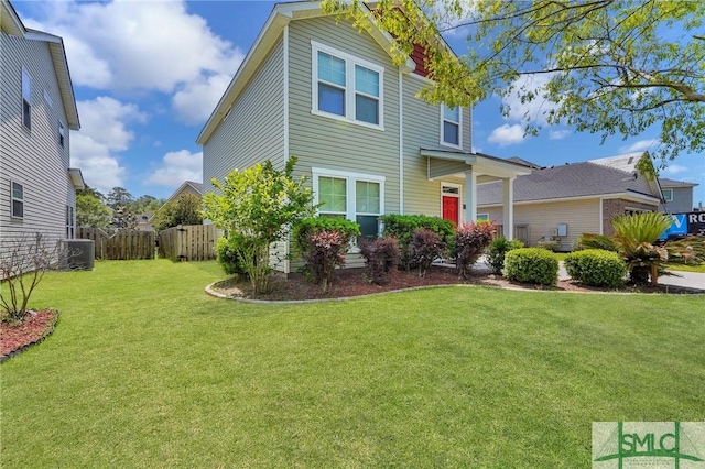 view of property exterior featuring a yard, fence, and cooling unit