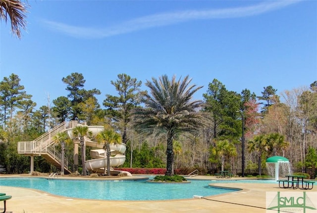 pool with stairs and a patio area