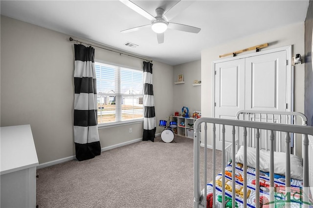 bedroom featuring visible vents, baseboards, carpet, and ceiling fan