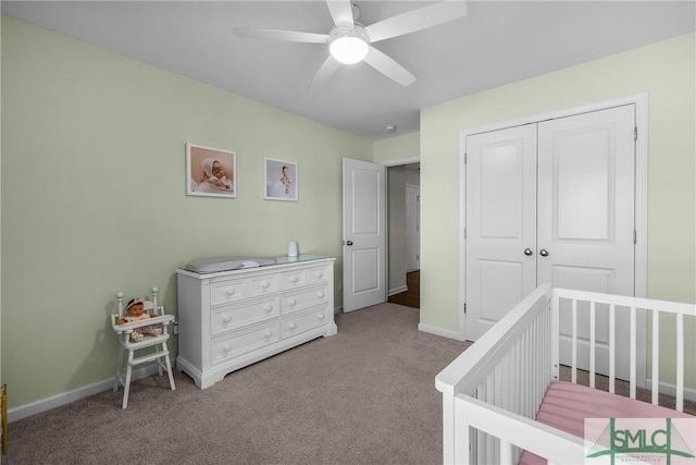 bedroom with ceiling fan, carpet, a closet, and baseboards